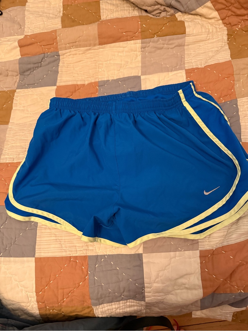 Nike Blue Athletic Shorts with Pale Yellow Trim